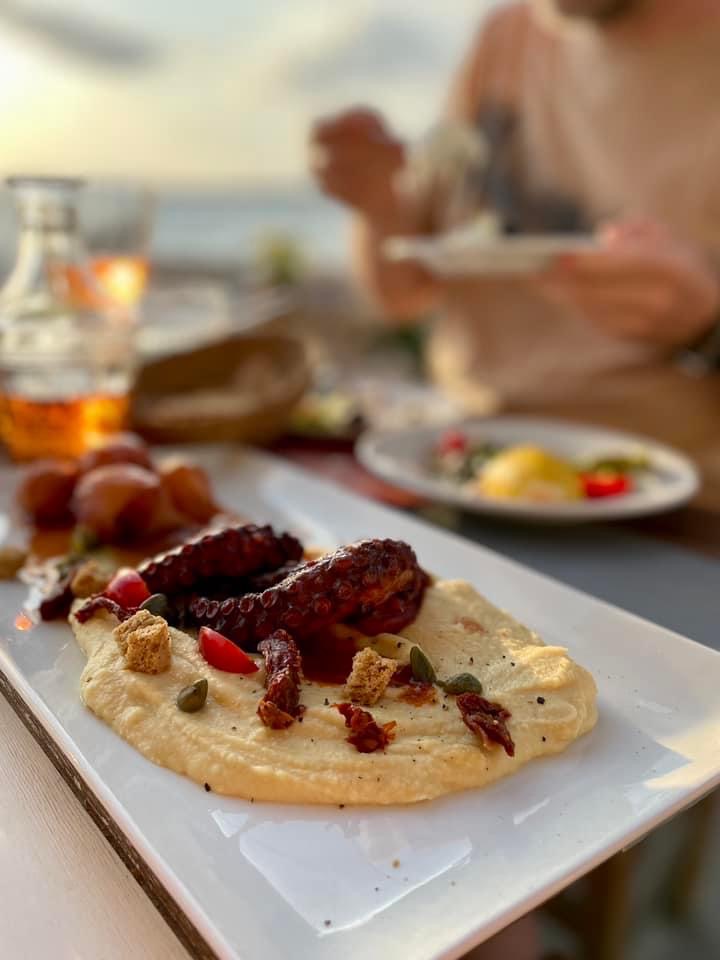 OCTOPUS STEEP with fava beans, sun-dried tomatoes, capers, onions, croutons, cherry tomatoes